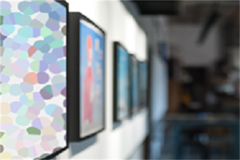 Image of various artworks on a wall