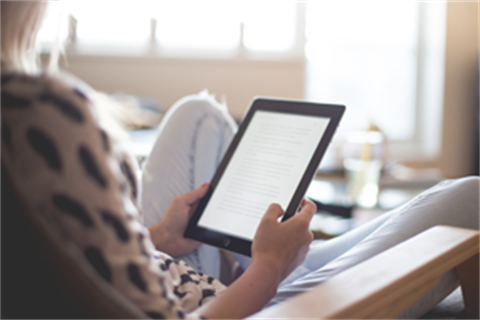 Woman-reading-tablet-300x200.png