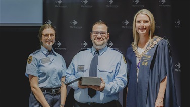 Mayor Cr Sarah Carter presenting a Mayoral Award to Matthea Rudolphy and Michael Bakatsoulas on behalf of SES Footscray Unit
