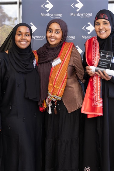 Duale Ruwayda, Anisa Mohamed and Fartun Farah on behalf of East African Women's Foundation recipient of a 2024 Mayoral Award