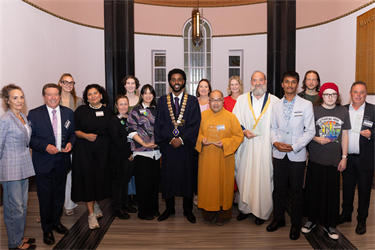Image of recipients of awards with the Mayor