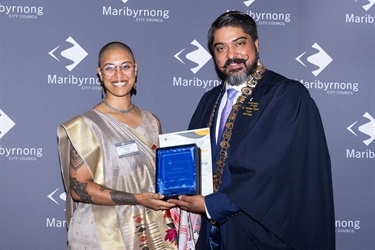 Mayor Cr Pradeep Tiwari presents Mishma Kumar-Jonson on behalf of The Iceberg Foundation with the LGBTIQA+ Leadership Award