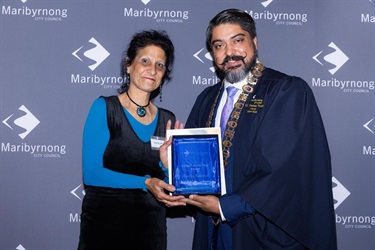 Mayor Cr Pradeep Tiwari presents Randa Beirouti with the Citizen of the Year Award