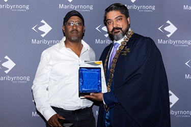 Mayor Cr Pradeep Tiwari presents Azhar Habib, Little Africa Precinct with the Enterprise Maribyrnong Award for New and Emerging Business