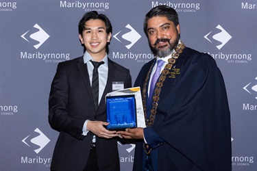 Mayor Cr Pradeep Tiwari presents Edward Le with the inaugural Les Twentyman Youth Leadership Award